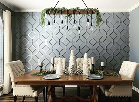Stylish interior showcasing a textured wall accent with geometric patterns in soft blue, complemented by rich hardwood flooring and elegant natural light from an open window.